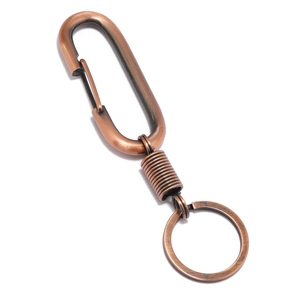 Vintage copper-colored metal spring keychain with secure spring hook and key ring