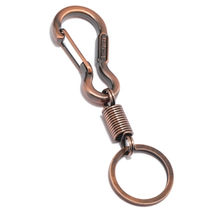 Vintage bronze alloy keychain featuring spring detail and engraved carabiner clip