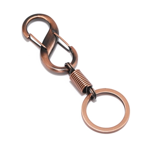 Retro copper alloy car keychain with dual S-hook carabiner and spring detail