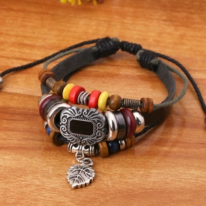 Multilayer leather bracelet with colorful wooden beads and a metallic leaf charm pendant