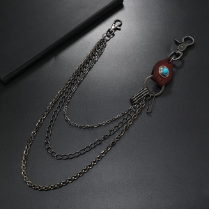 Three-layer silver metal pants chain with brown leather patch and turquoise bead detail