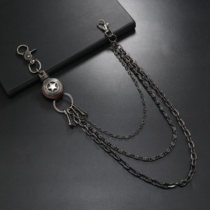 Close-up of triple-layered gunmetal pant chains with pentagram pendant and lobster clasps