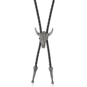 Vintage western bolo tie with silver bull head skull pendant on black braided cord