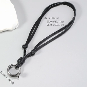 Adjustable vintage leather necklace featuring a rustic silver-toned ring pendant
