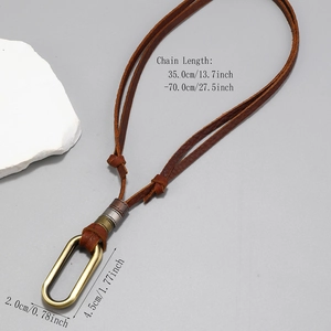 Adjustable long leather sweater necklace with bronze oval pendant and metallic rings