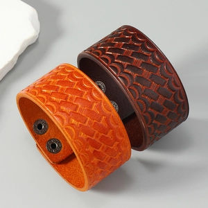 Adjustable wide leather bracelets in orange and dark brown with woven texture