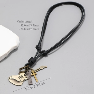 Retro leather necklace with bronze guitar, cross and engraved plate on grey background