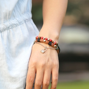 Multilayer leather bracelet set with red beads, braided cord, and padlock charm