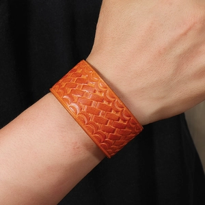 Fashionable minimalist wide orange leather bracelet with woven embossed texture for men