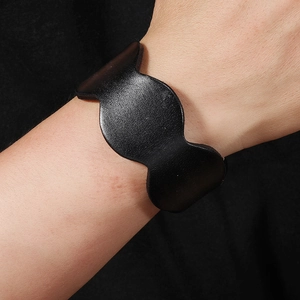 Minimalist black leather wide cuff bracelet with stylish wavy edge design for women