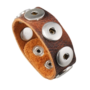 Retro brown leather bracelet with adjustable silver metal studs on a white background