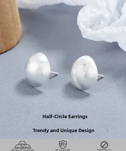 Macro detail of 925 sterling silver half-round stud earrings with a brushed matte finish