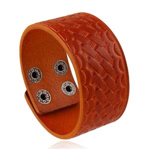 Adjustable brown wide leather bracelet with woven texture and silver metal snap buttons