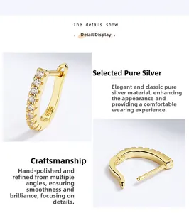 Detailed view of gold S925 sterling silver hoop earrings with sparkling white zircons