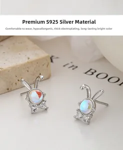 Detail of 925 silver bunny studs featuring moonstone inlay and zircon bowknot