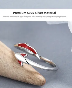 Macro view of 925 sterling silver koi fish ring with vibrant red enamel details