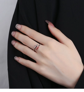 Detailed view of an adjustable 925 silver koi fish ring with red and black enamel