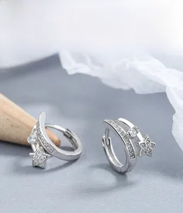 Macro detail of 925 sterling silver star hoop earrings with micro-pave cubic zirconia