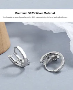 Macro detail of S925 sterling silver star hoop earring with hallmark stamp engraving