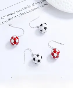 Detailed view of S925 sterling silver soccer ball earrings with red and black enamel