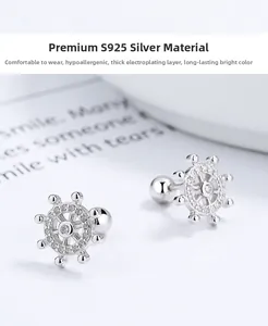 Macro shot of S925 silver helm stud earrings with zircon inlay and screw-back closure