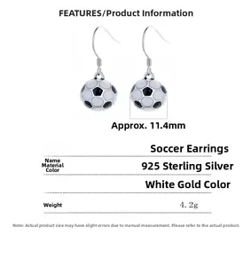 Detailed view of 925 sterling silver soccer ball earrings with black and white enamel