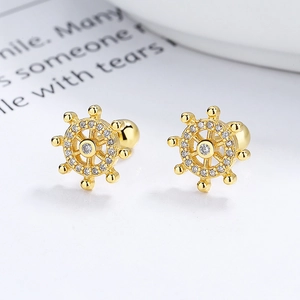 Gold plated 925 sterling silver nautical helm stud earrings with white zircon accents