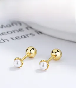 Detailed close-up of 925 sterling silver pearl earrings with a gold-plated finish