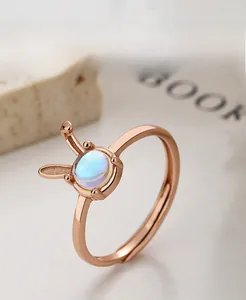 Macro shot of rose gold plated S925 silver rabbit ring with moonstone center