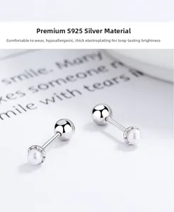 Close-up of S925 sterling silver pearl stud earrings with secure screw-back design
