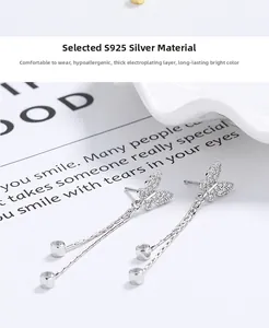 Macro detail of S925 sterling silver butterfly earrings with long tassel chain fringe