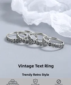 Macro detail of three vintage 925 sterling silver rings with engraved Chinese characters