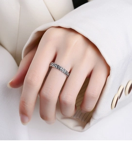 Detailed view of vintage S925 sterling silver ring with embossed Chinese lucky characters