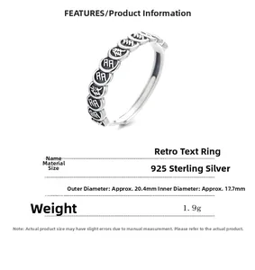 Detailed macro of 925 sterling silver vintage ring featuring Chinese fortune engravings