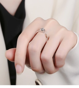 Detail of 925 sterling silver open ring featuring cute 3D bunny and carrot motifs