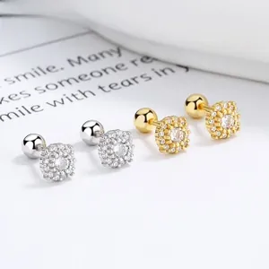 Macro view of 925 silver screw back earrings with square cubic zirconia floral design