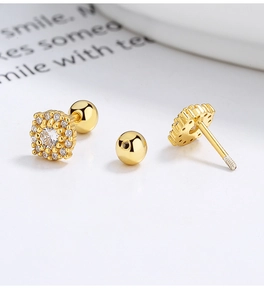 Macro view of 925 silver flower stud earrings with zircon pavé and screw ball backing