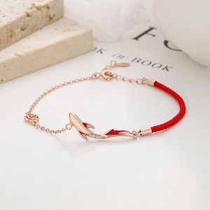Lucky koi carp red string bracelet in rose gold with enamel fish charm and diamonds