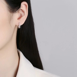 Minimalist 925 sterling silver hoop earrings with a row of sparkling white zircons