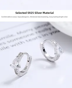 Detail of S925 sterling silver hoop earrings featuring a pear-cut drop cubic zirconia