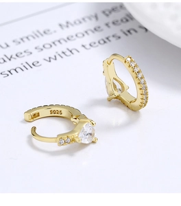 Macro shot showing the S925 hallmark on a gold-plated sterling silver hoop earring
