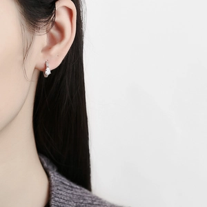 Elegant 925 sterling silver hoop earrings with water drop zircon on model