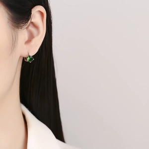 925 silver emerald earrings with retro round green zircon stones on female model