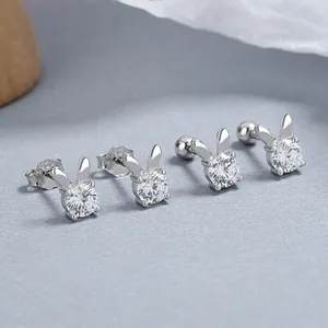 Macro view of 925 sterling silver bunny stud earrings with zircon stones and screw backs