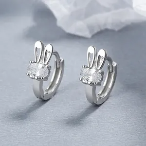 Detailed close-up of rabbit-shaped 925 silver hoop earrings with oval zircon stones