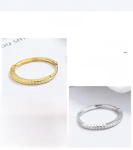 Detailed close-up of 925 sterling silver wheat ear rings in gold and silver finishes