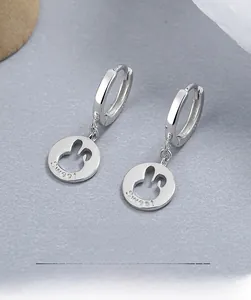 Detailed macro view of S925 sterling silver rabbit earrings with Sweet engraving