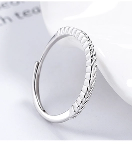 Detailed view of sterling silver adjustable ring with intricate wheat ear relief pattern