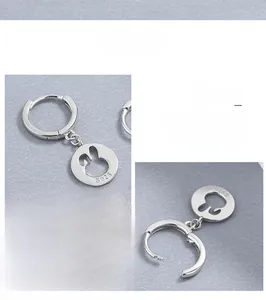 Detailed close-up of 925 sterling silver hoop earrings with hollow rabbit charm charms