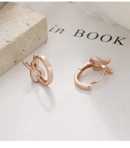 Detailed close-up of rose gold S925 sterling silver hoop earrings with rabbit ear design